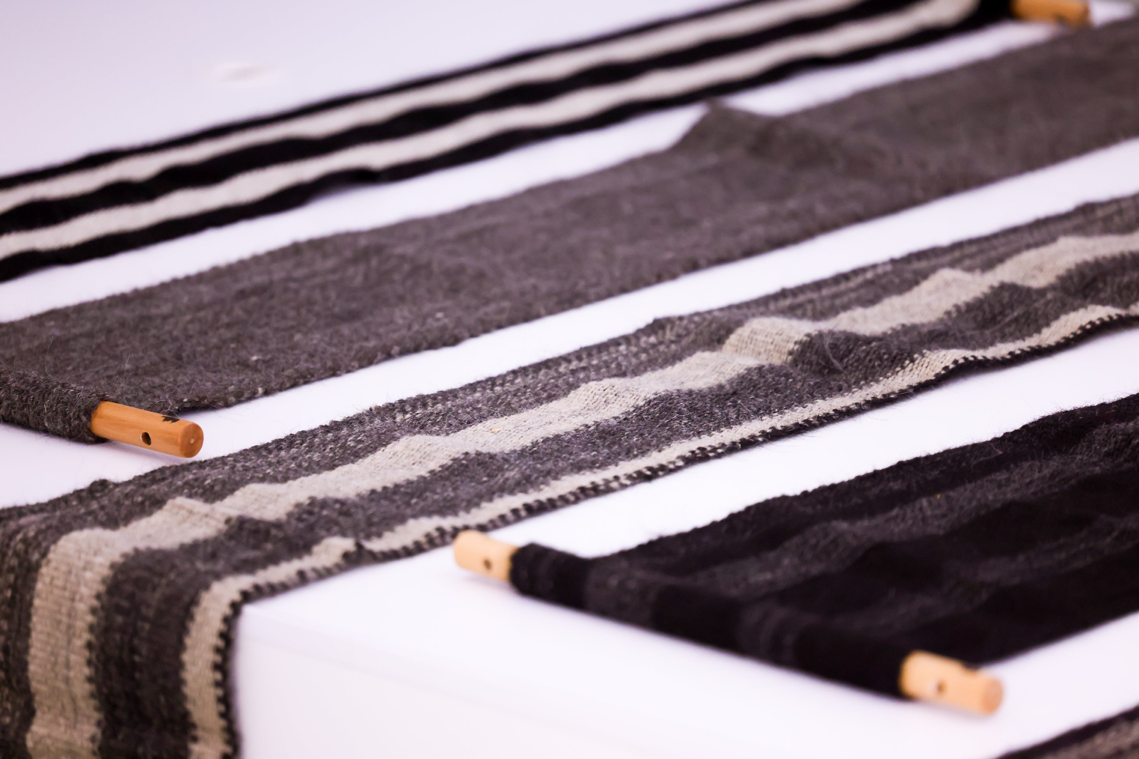 Shades of Yak. These decorative cloths are meticulously handwoven from authentic yak fabric, honoring traditional techniques passed down through generations in the highlands of Tibet. Each piece reflects the artisans' dedication to preserving their culture while creating unique, sustainable textiles.